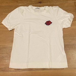 White top with embroidered design